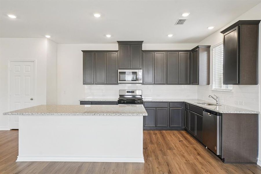 Furnished interior view inside a new home in Heartland Signature, Heartland (Image 7).
