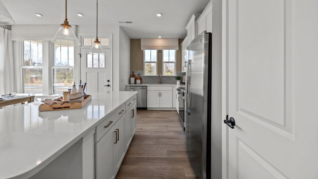 The Rochester Plan by DRB homes kitchen with island and modern features in Charlotte, NC.