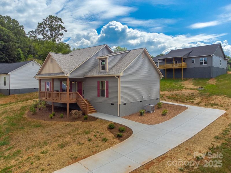 Front exterior of a new home in , Franklin, NC, highlighting curb appeal (Image 26).