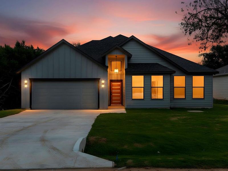 Front exterior of a new home in , Granbury, TX, highlighting curb appeal (Image 2).