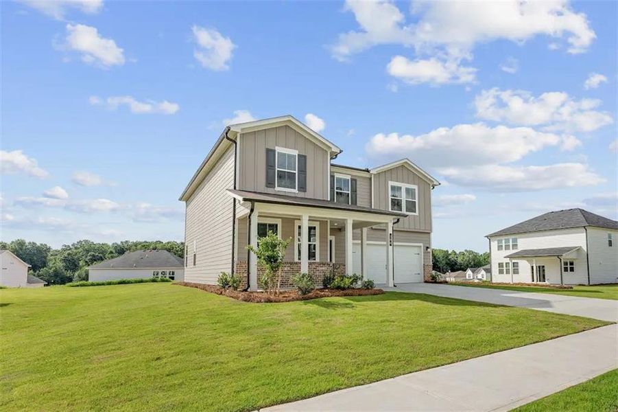 Front exterior of a new home in Reserve at Gum Springs, Jefferson, GA, highlighting curb appeal (Image 7). Front exterior of a new home in Reserve at Gum Springs, Jefferson, GA, highlighting curb appeal (Image 7).