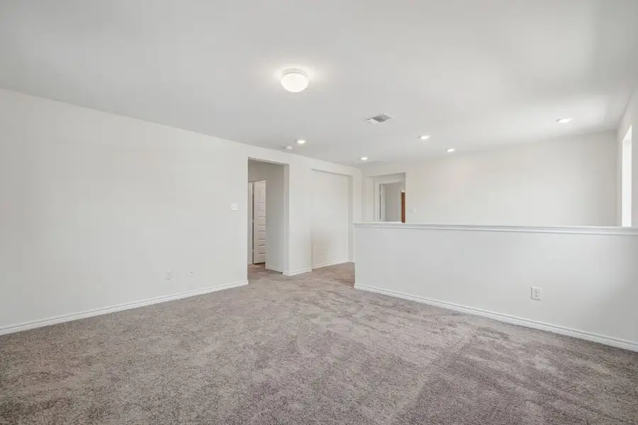 Spacious, unfurnished interior of a new home in Preserve at Culebra - Sterling Collection, San Antonio (Image 25).
