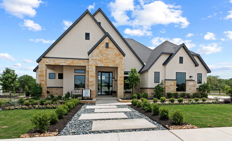 Front exterior of a new home in Caliza Reserve, Boerne, TX, highlighting curb appeal (Image 23).