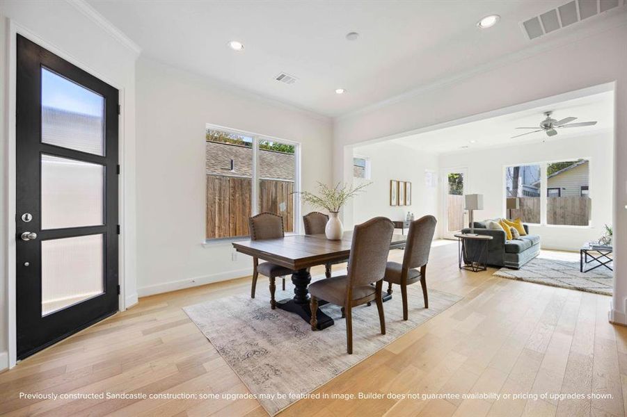 Central Sophistication: Right where family and friends converge, this dining room is the true heart of the home, bathed in welcoming natural light.