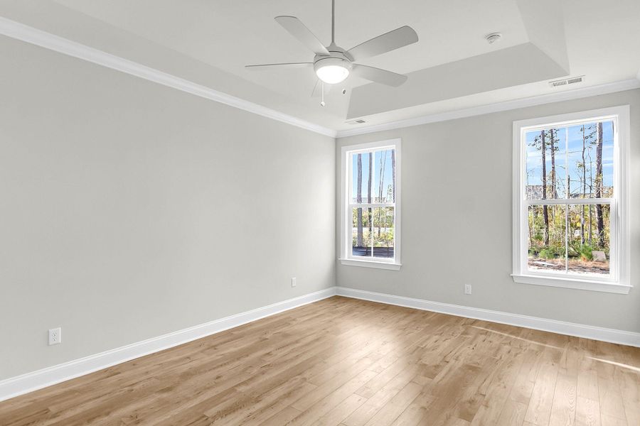 Spacious, unfurnished interior of a new home in Tidewater at Lakes of Cane Bay, Summerville (Image 46).