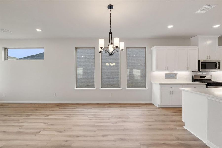 Nestled in between the kitchen and family room, this perfectly placed dining room offers a wonderful space for lively dinner parties or cozy family get togethers.