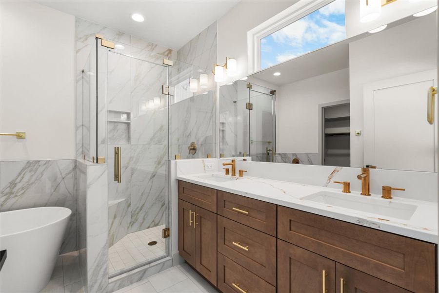 Primary bath — double vanity, freestanding soaking tub, and frameless glass shower Primary bath — double vanity, freestanding soaking tub, and frameless glass shower