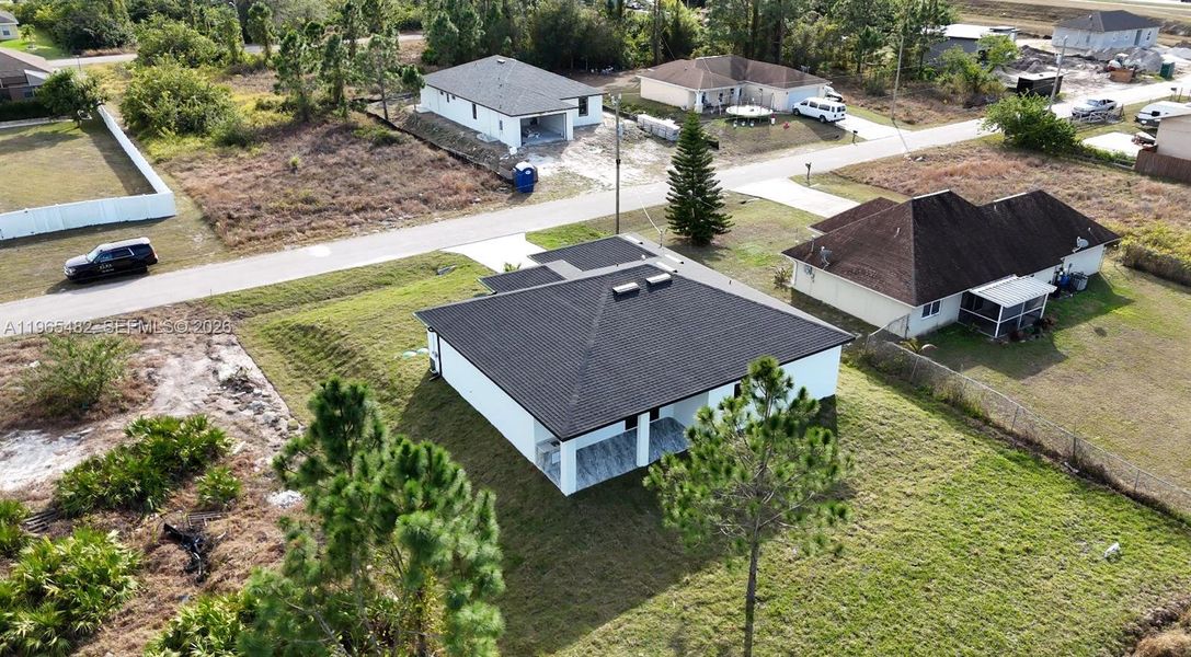 Front exterior of a new home in , Lehigh Acres, FL, highlighting curb appeal (Image 23).