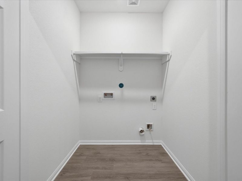 Designed with functionality in mind, the utility room provides a practical space to keep daily routines organized and out of sight. Designed with functionality in mind, the utility room provides a practical space to keep daily routines organized and out of sight.