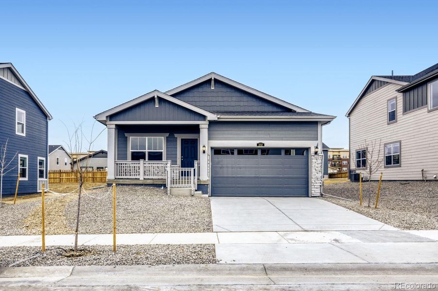 Front exterior of a new home in Ledge Rock, Johnstown, CO, highlighting curb appeal (Image 1). Front exterior of a new home in Ledge Rock, Johnstown, CO, highlighting curb appeal (Image 1).