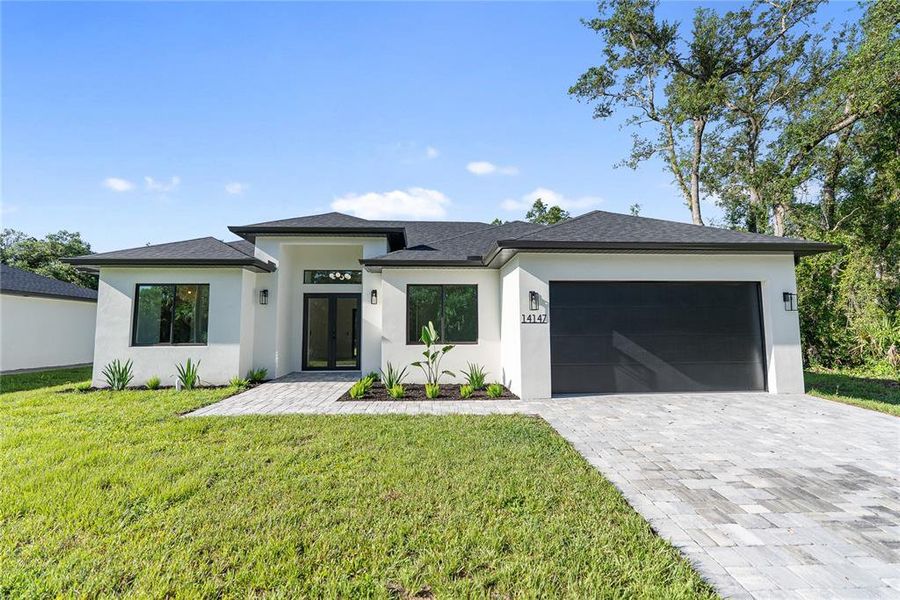 Front exterior of a new home in , Port Charlotte, FL, highlighting curb appeal (Image 27). Front exterior of a new home in , Port Charlotte, FL, highlighting curb appeal (Image 27).