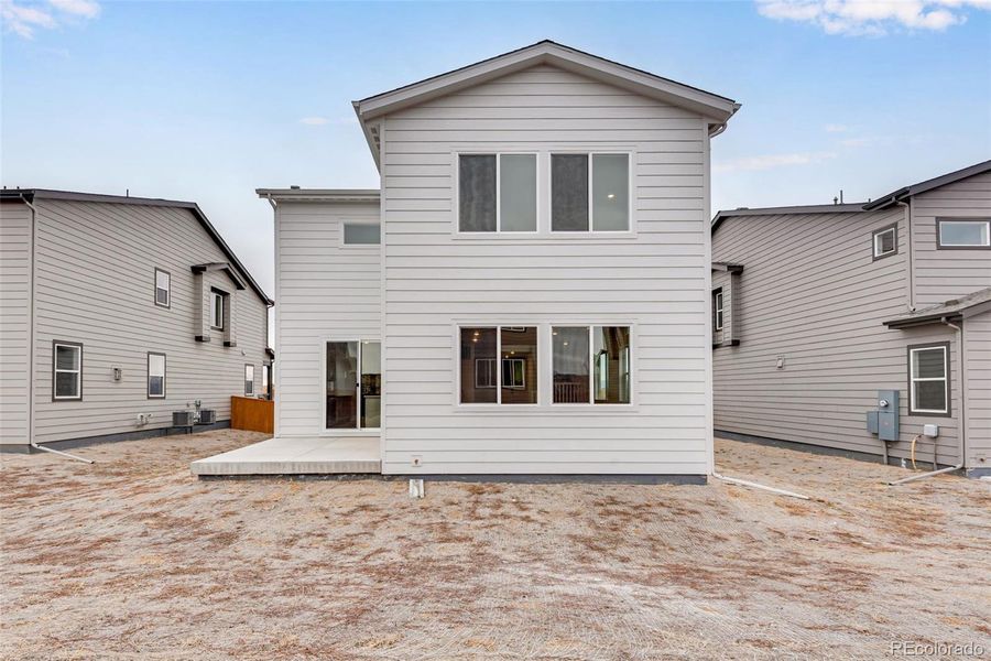 Exterior details and patio area of a home in Reunion, Commerce City (Image 24).