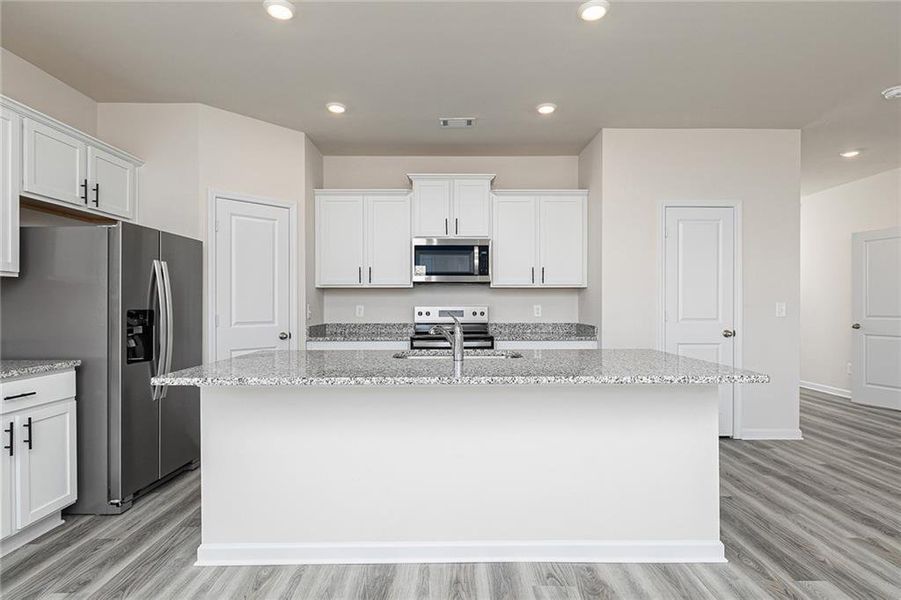 Furnished interior view inside a new home in Conners Landing at Mirror Lake, Villa Rica (Image 7).