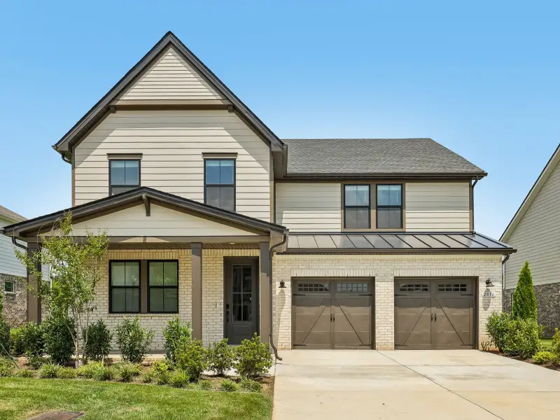 Front exterior of a new home in Station Hill - Reserve Series, Franklin, TN, highlighting curb appeal (Image 1). Front exterior of a new home in Station Hill - Reserve Series, Franklin, TN, highlighting curb appeal (Image 1).