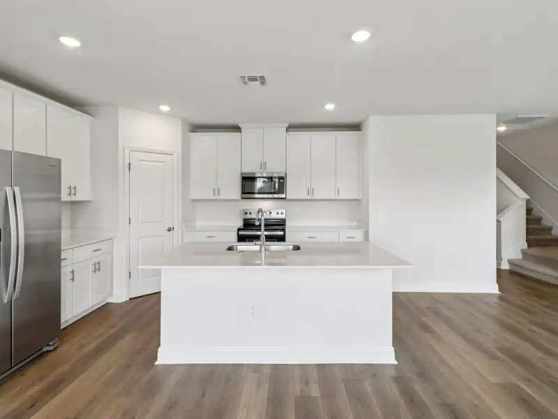 Furnished interior view inside a new home in Villamar - Classic Series, Winter Haven (Image 3).