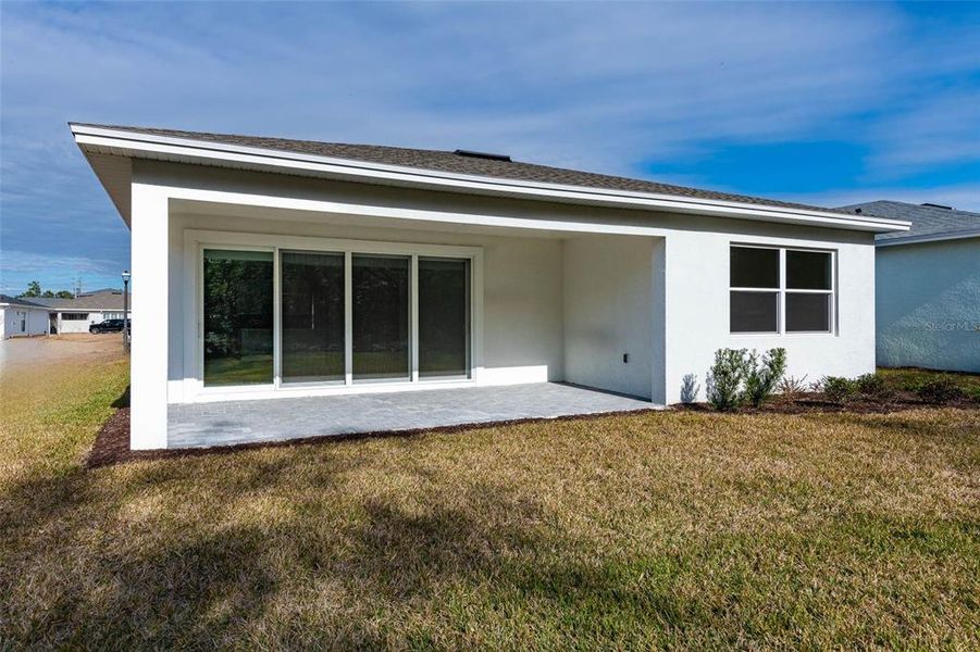 Exterior details and patio area of a home in Cresswind DeLand, Deland (Image 3).