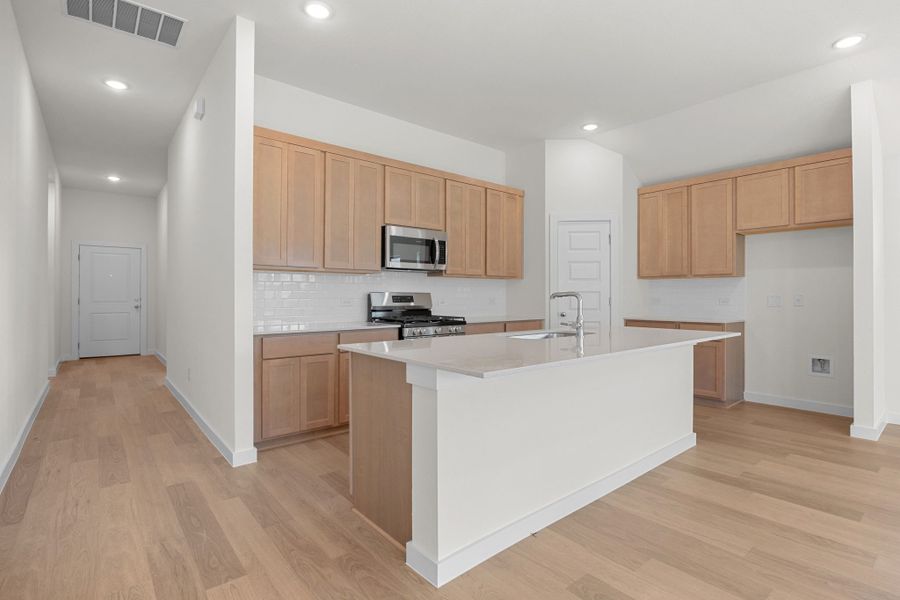 Kitchen in the Sabine home plan by Trophy Signature Homes – REPRESENTATIVE PHOTO Kitchen in the Sabine home plan by Trophy Signature Homes – REPRESENTATIVE PHOTO