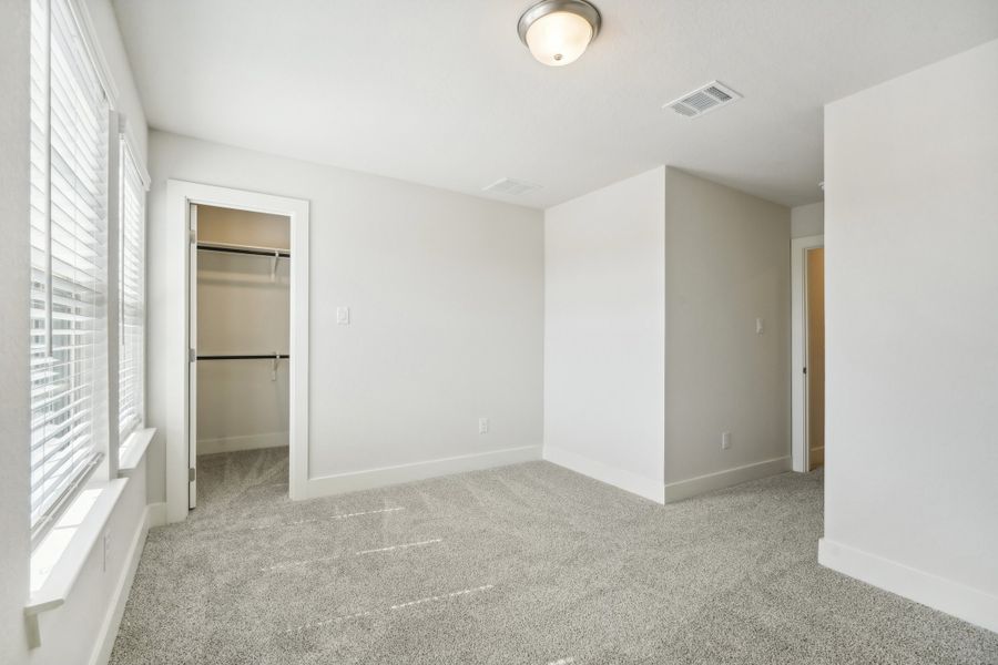 Guest bedroom in the Medina floorplan at a Meritage Homes community.