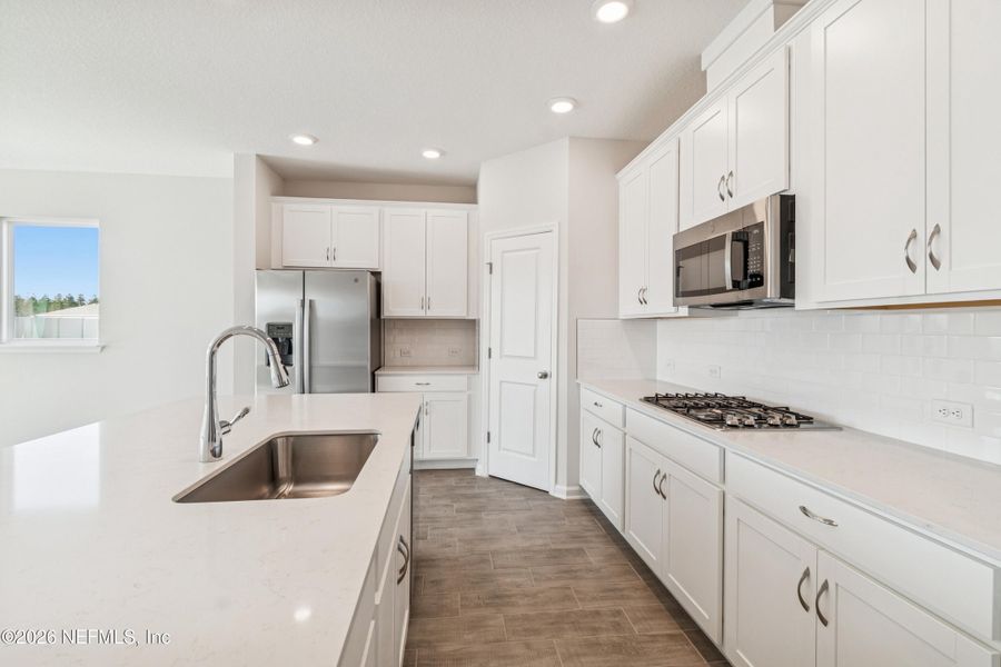 Furnished interior view inside a new home in Tributary 50', Yulee (Image 10).