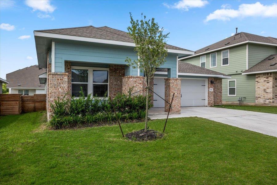 A welcoming facade showcases brick pillars, a neat lawn, and an integrated garage, all under a clear sky. A welcoming facade showcases brick pillars, a neat lawn, and an integrated garage, all under a clear sky.