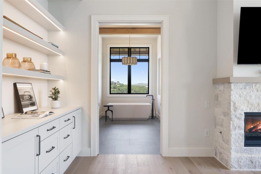 Hall with light wood finished floors and baseboards