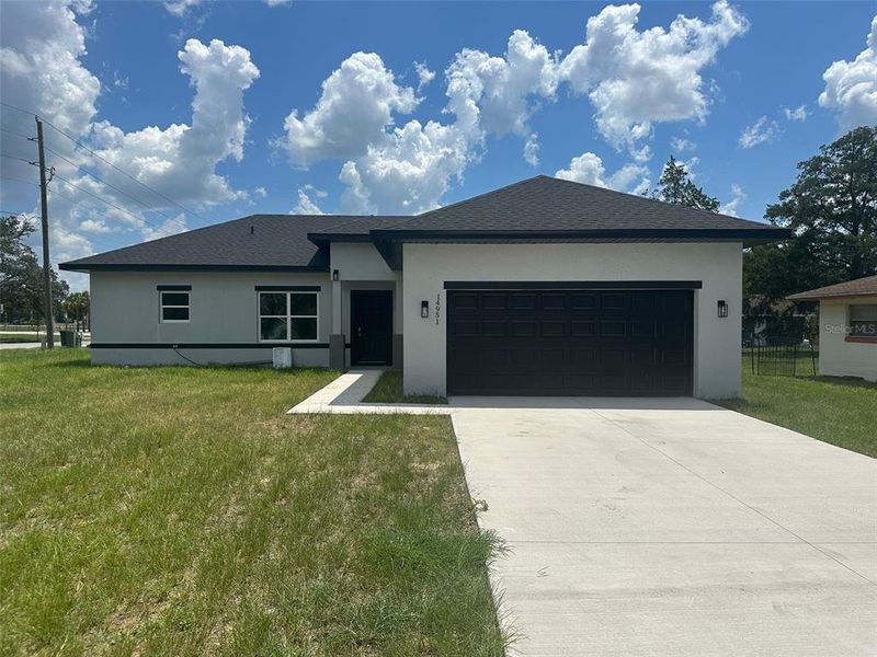 Front exterior of a new home in , Ocala, FL, highlighting curb appeal (Image 1).