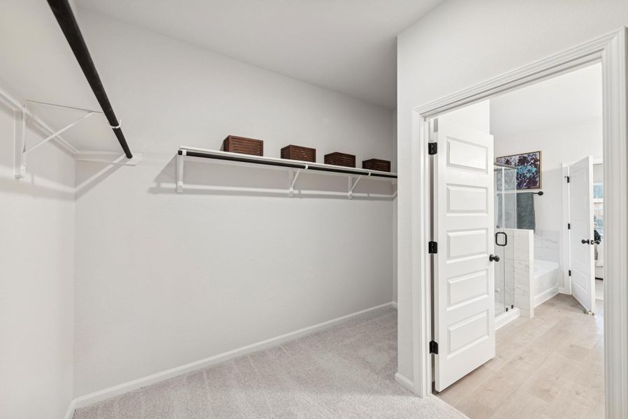 The Princeton II- Primary Bath Walk-In Closet. Staged model home shown for illustration only; actual features, colors, and upgrades may vary.