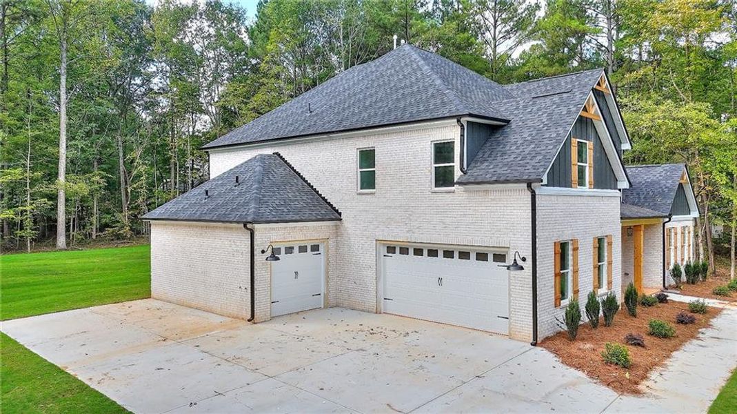 Front exterior of a new home in , Monroe, GA, highlighting curb appeal (Image 20). Front exterior of a new home in , Monroe, GA, highlighting curb appeal (Image 20).