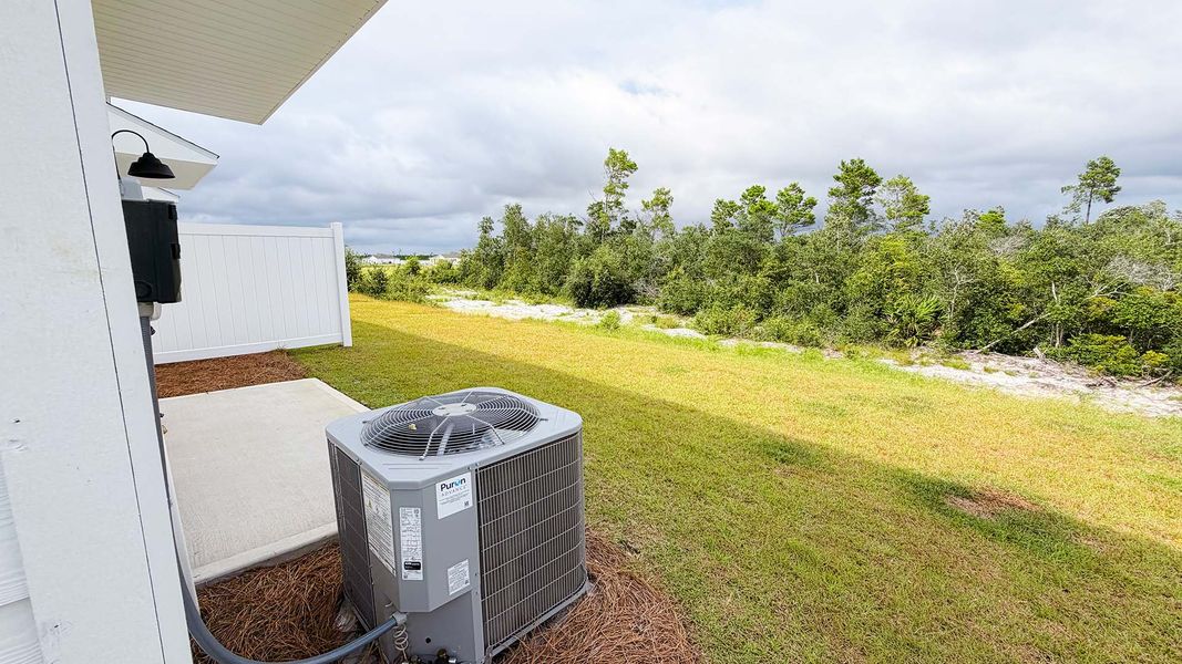 Exterior details and patio area of a home in Salt Creek Townhomes at Mexico Beach, Mexico Beach (Image 18).