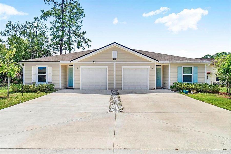 Front exterior of a new home in , Palm Coast, FL, highlighting curb appeal (Image 21).
