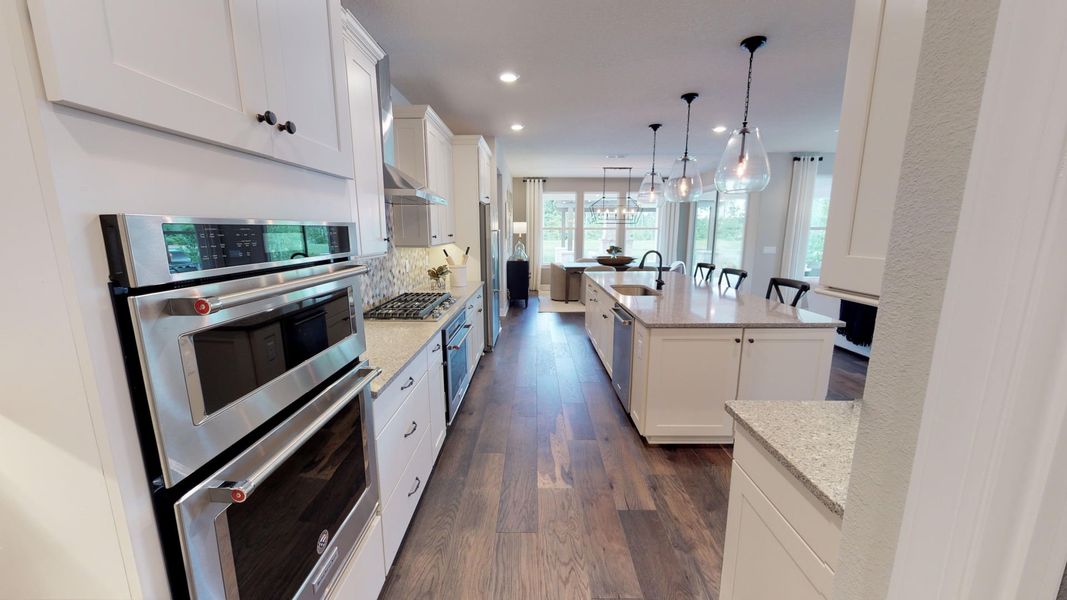 Gourmet Kitchen with Oversized Island and Stainless Steel Appliances