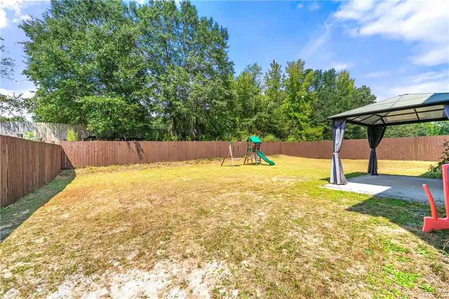 Front exterior of a new home in , Loganville, GA, highlighting curb appeal (Image 1).