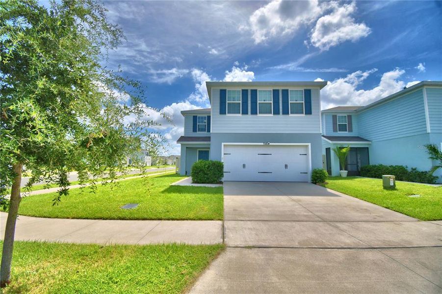 Front exterior of a new home in , Haines City, FL, highlighting curb appeal (Image 23). Front exterior of a new home in , Haines City, FL, highlighting curb appeal (Image 23).