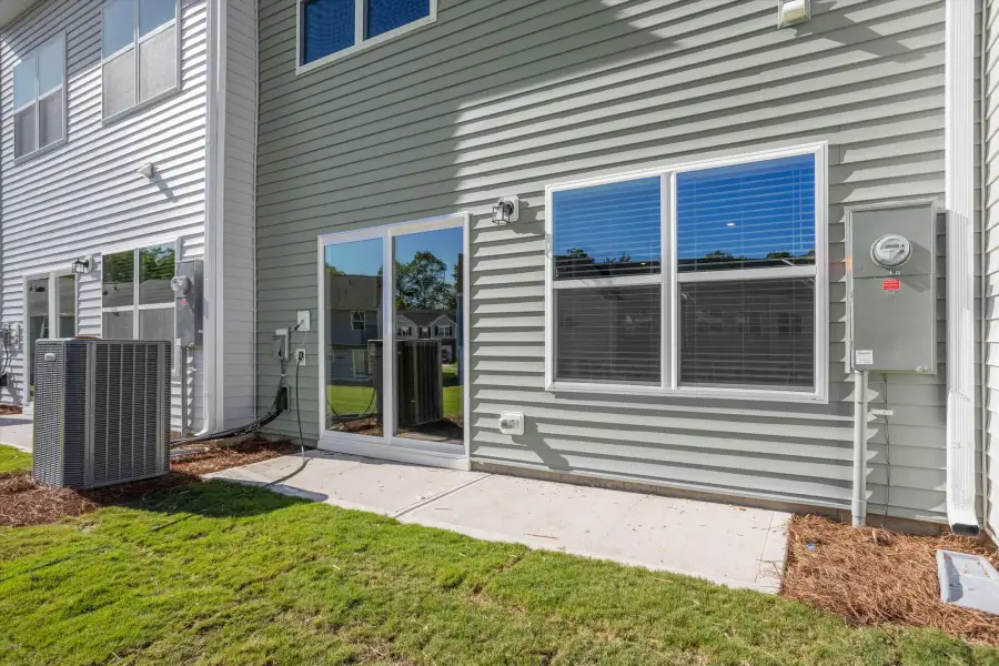 Exterior details and patio area of a home in West Main Townhomes, Sanford (Image 2). Exterior details and patio area of a home in West Main Townhomes, Sanford (Image 2).