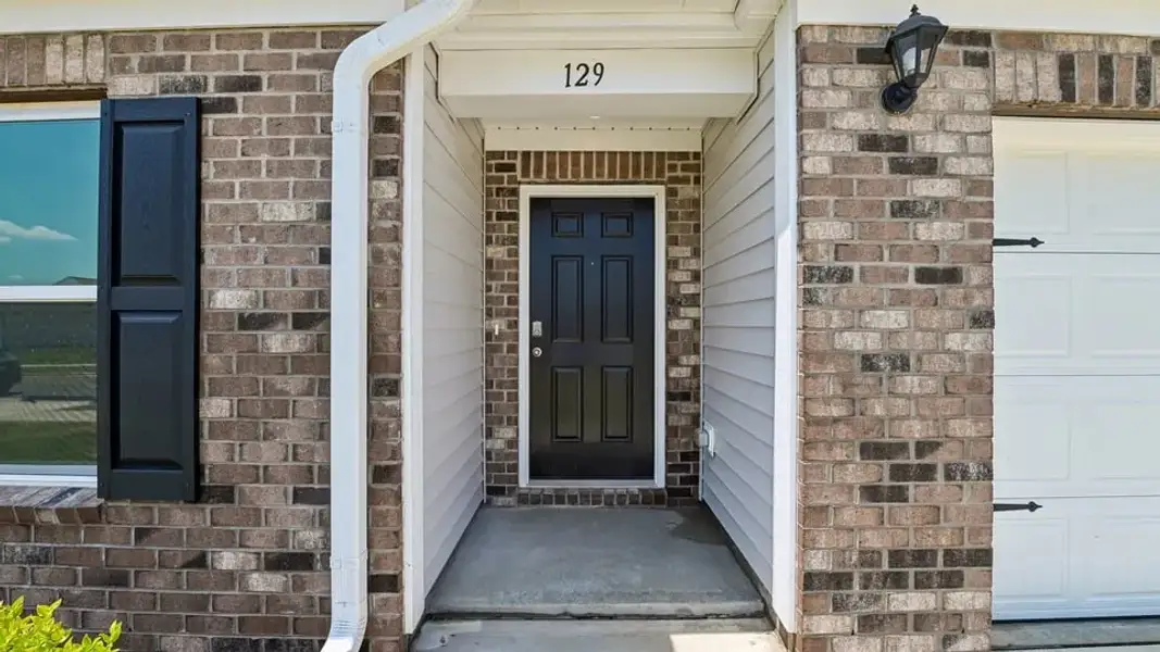 Exterior details and patio area of a home in Wilson's Ridge, Wilson's Mills (Image 3).