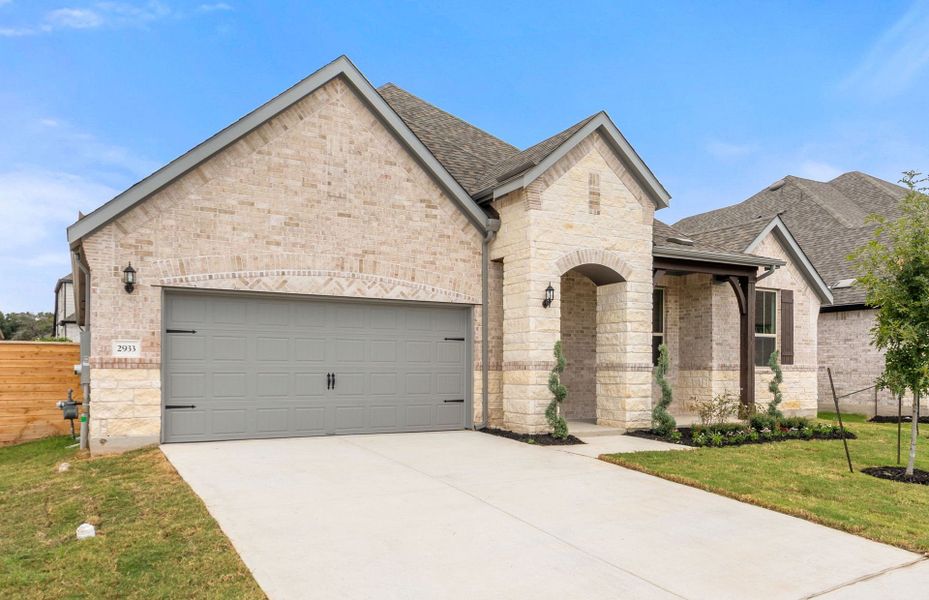 Front exterior of a new home in Bluffview Reserve, Leander, TX, highlighting curb appeal (Image 25).