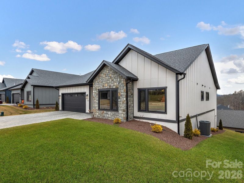 Front exterior of a new home in , Arden, NC, highlighting curb appeal (Image 21).