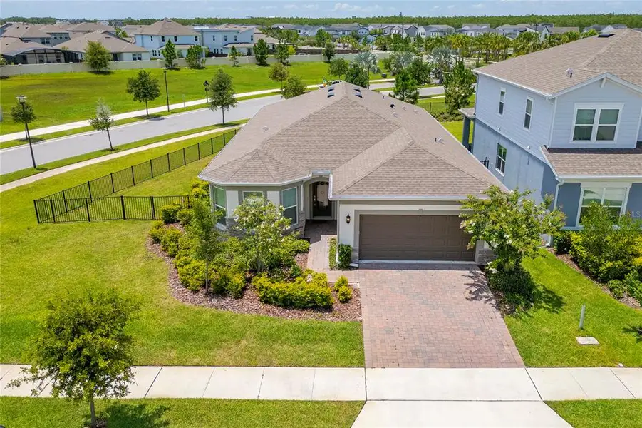 Front exterior of a new home in Isles of Lake Nona, Orlando, FL, highlighting curb appeal (Image 1). Front exterior of a new home in Isles of Lake Nona, Orlando, FL, highlighting curb appeal (Image 1).