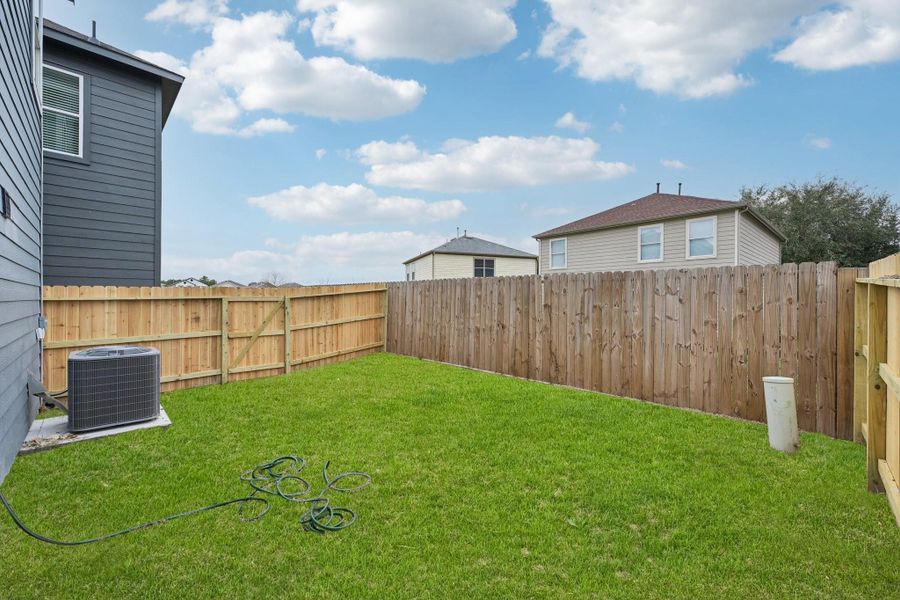 Enjoy a spacious backyard that is ideal for outdoor activities, gardening, or just unwinding in the sun.
