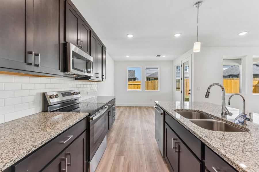 Furnished interior view inside a new home in Freedom at Anthem, Kyle (Image 6).