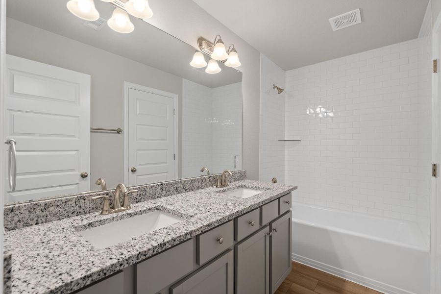 Furnished interior view inside a new home in Sunterra, Katy (Image 26).