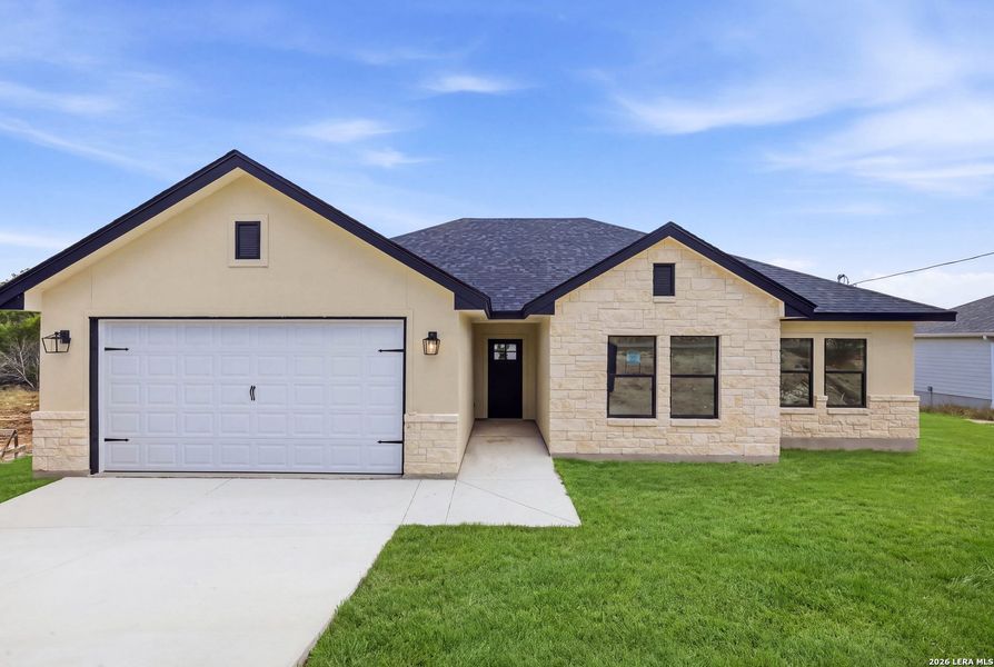 Front exterior of a new home in , Fischer, TX, highlighting curb appeal (Image 29). Front exterior of a new home in , Fischer, TX, highlighting curb appeal (Image 29).
