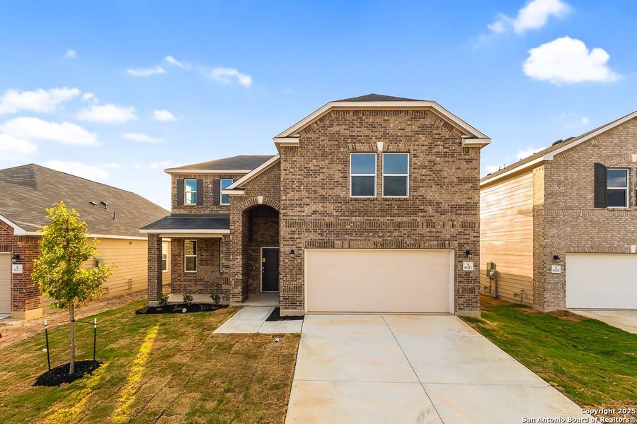 Front exterior of a new home in Preserve at Culebra - Classic Collection, San Antonio, TX, highlighting curb appeal (Image 1). Front exterior of a new home in Preserve at Culebra - Classic Collection, San Antonio, TX, highlighting curb appeal (Image 1).