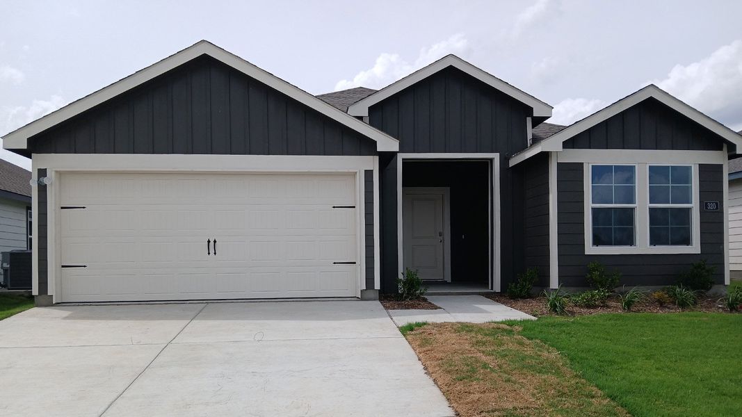 Front exterior of a new home in Wildwood, Royse City, TX, highlighting curb appeal (Image 1). Front exterior of a new home in Wildwood, Royse City, TX, highlighting curb appeal (Image 1).