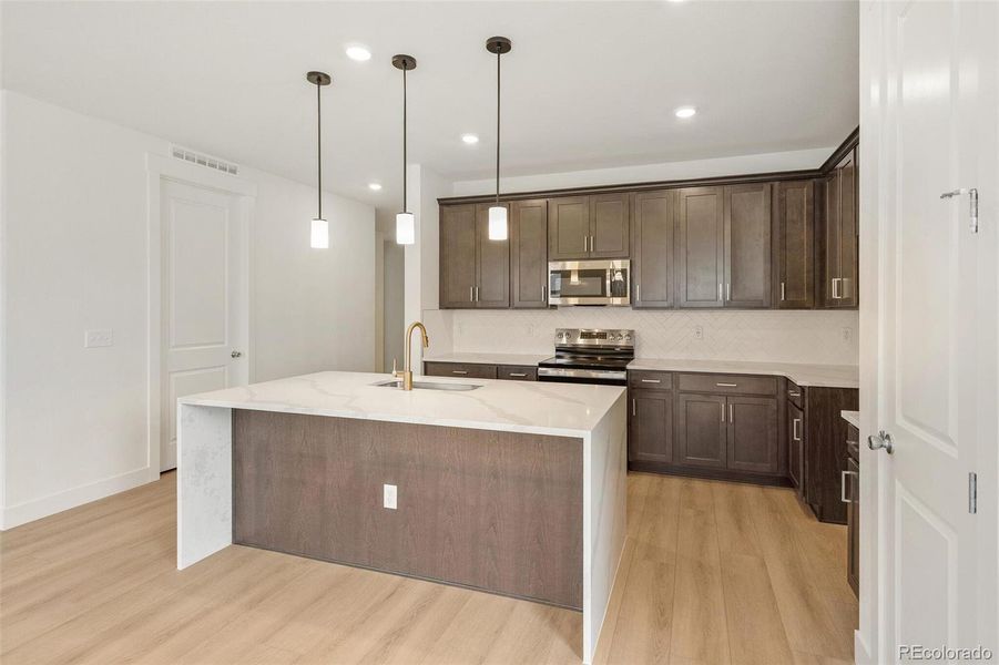 Furnished interior view inside a new home in Painted Prairie, Aurora (Image 11).