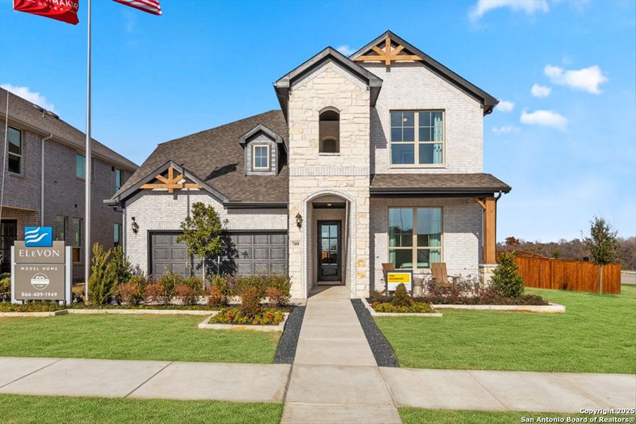 Front exterior of a new home in Vista Ridge, Live Oak, TX, highlighting curb appeal (Image 1).