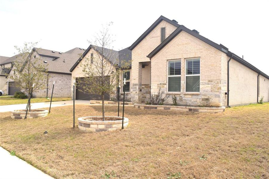 Front exterior of a new home in , Hickory Creek, TX, highlighting curb appeal (Image 26).