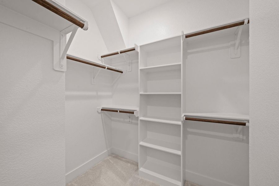 This closet is a perfect blank canvas to design a custom closet with ample hanging space, perfectly organized drawers, and chic shoe racks come together seamlessly, ensuring that everything has its place. This closet is a perfect blank canvas to design a custom closet with ample hanging space, perfectly organized drawers, and chic shoe racks come together seamlessly, ensuring that everything has its place.