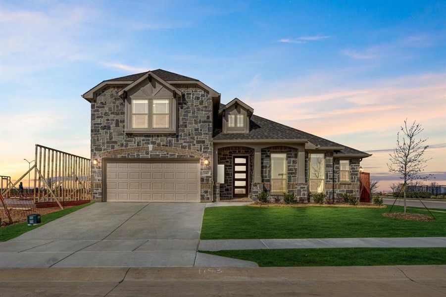 Front exterior of a new home in Timberbrook, Justin, TX, highlighting curb appeal (Image 2).