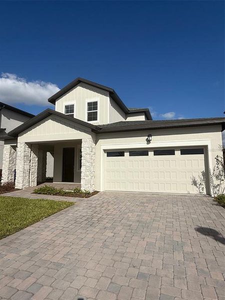 Front exterior of a new home in , St. Cloud, FL, highlighting curb appeal (Image 1).